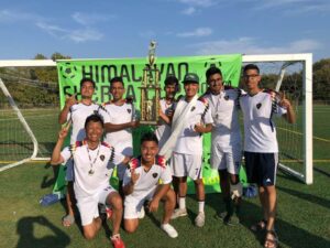 soccer team photo with trophy
