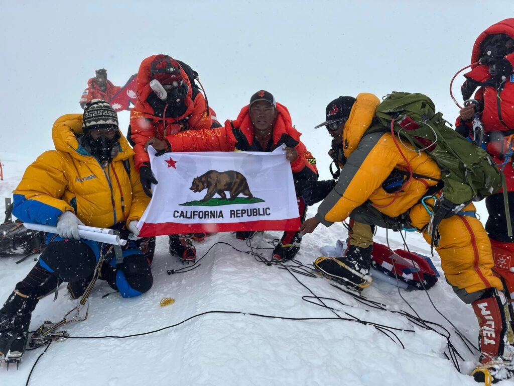 Sherpa standing on top of Mt K2